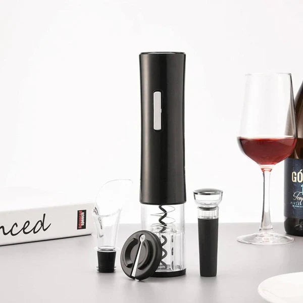 Električni set za vino na stolu uz čašu crnog vina