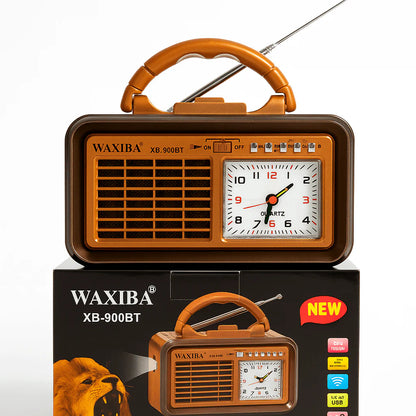 Retro prijenosni radio sa analognim satom ispred originalne kutije